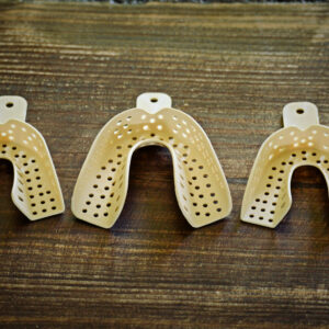 Removable Veneers USA impression trays in a row